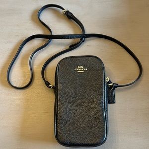 Never worn black and gold Coach crossbody